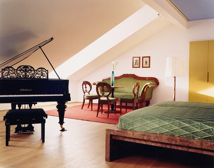 Room with antique furniture and piano