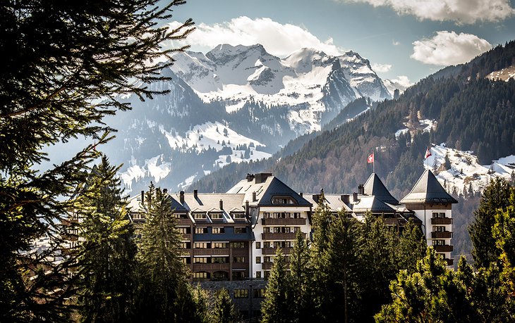 Alpina Gstaad Hotel with Snowy Alps in the Background