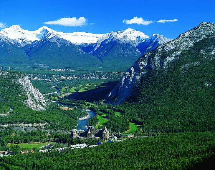 View of Banff nature with mountains and Fairmont Banff Springs Hotel