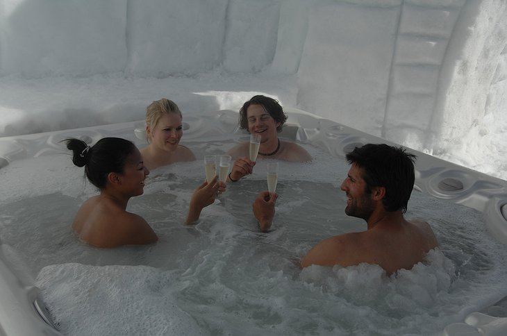 People drinking champagne in the jacuzzi