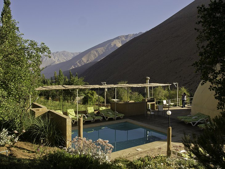 Elqui Domos pool and the mountains in the background