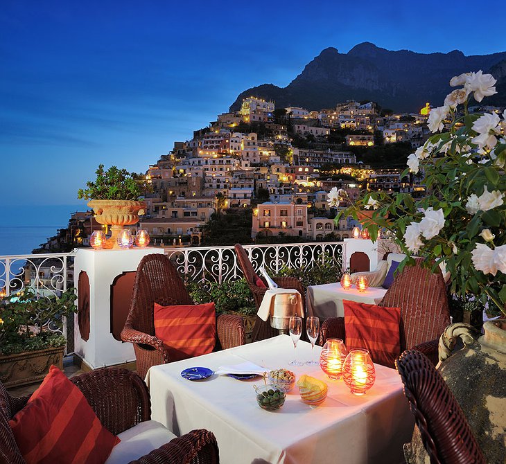 Dining in the evening on the terrace at Le Sirenuse Hotel