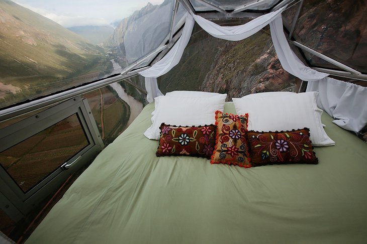 Skylodge Adventure Suites bedroom with panoramic mountain views