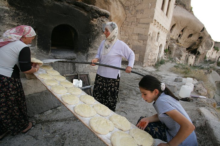 Women baking pita bread