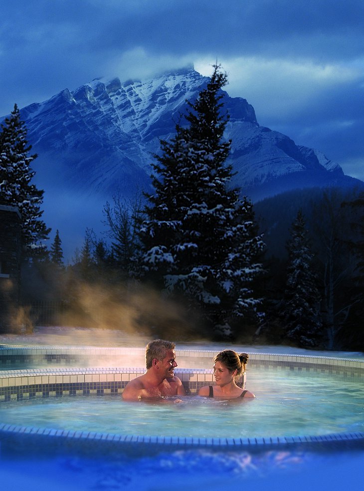 Couple in the steaming hot jacuzzi of Fairmont Banff Springs Hotel