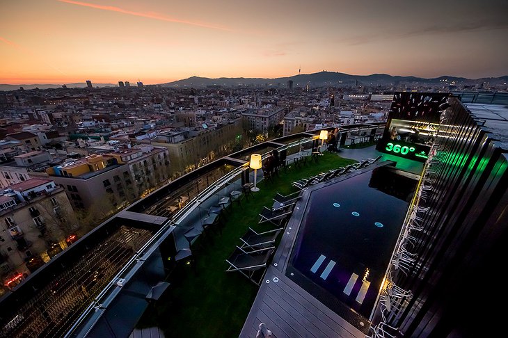 Barceló Raval rooftop terrace at night with pool