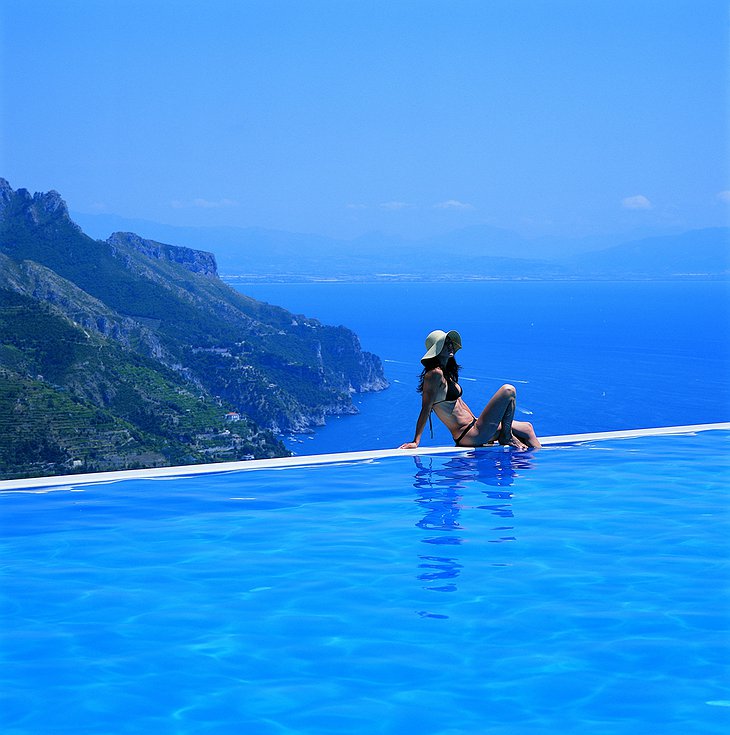 Girl at the edge of the infinity-pool
