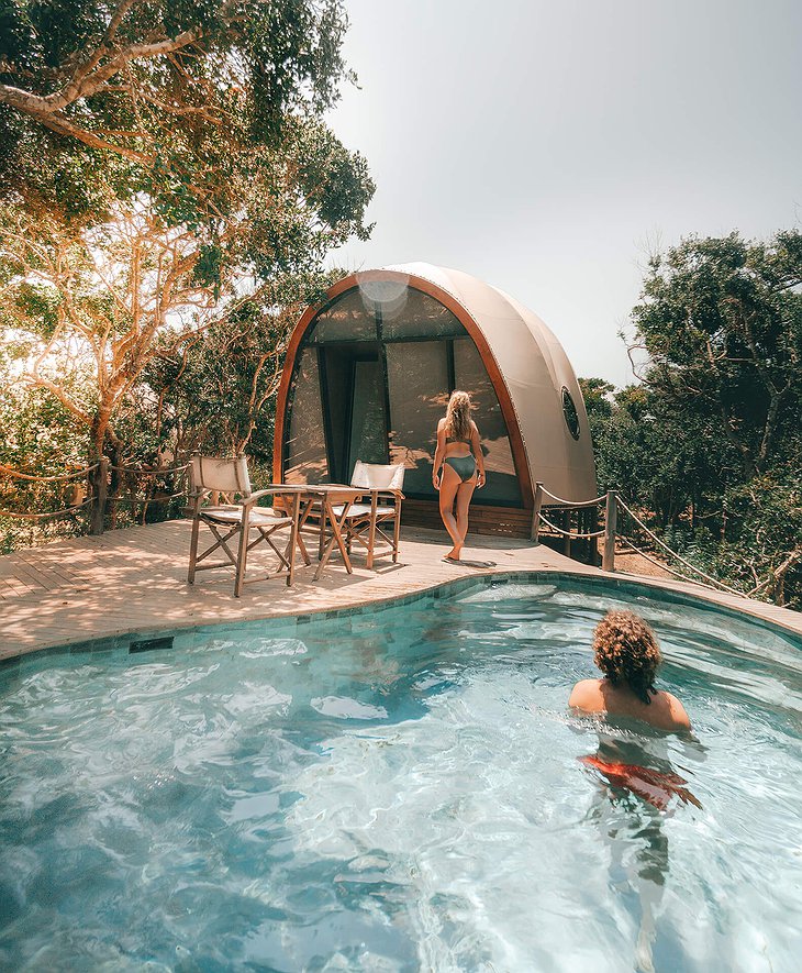 Wild Coast Tented Lodge cocoon tent with pool and a young couple