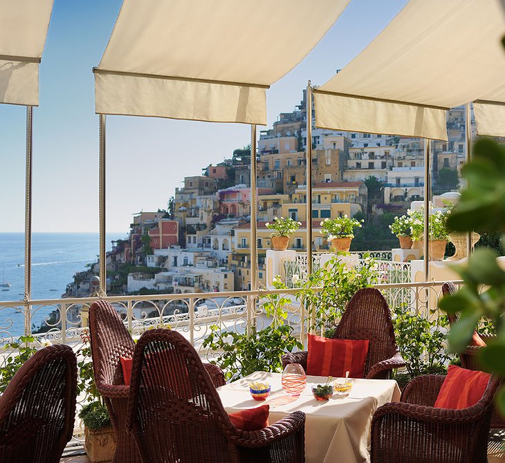 Dining on the terrace of Le Sirenuse Hotel with view on Positano