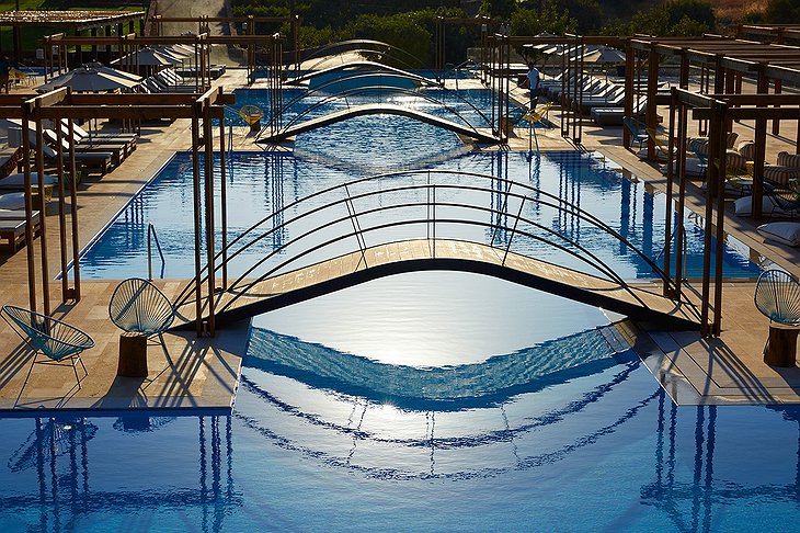 Domes of Elounda outdoor pools with bridges above them