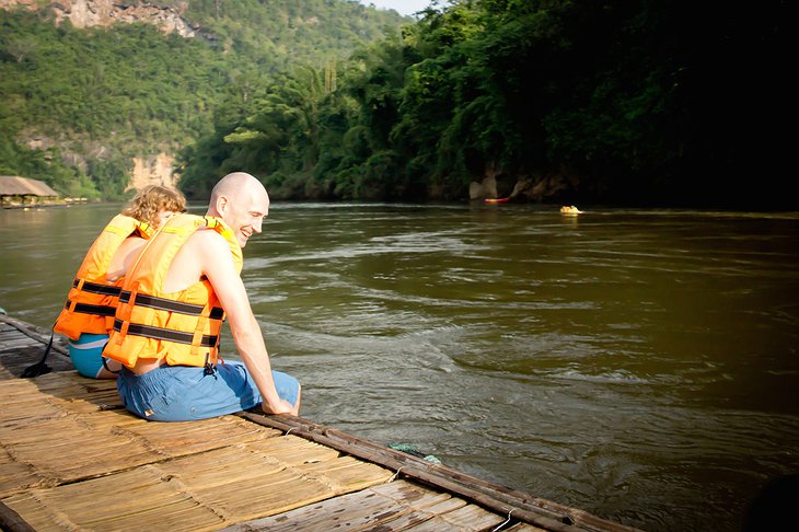 Sitting on the wooden platform at the River Kwai