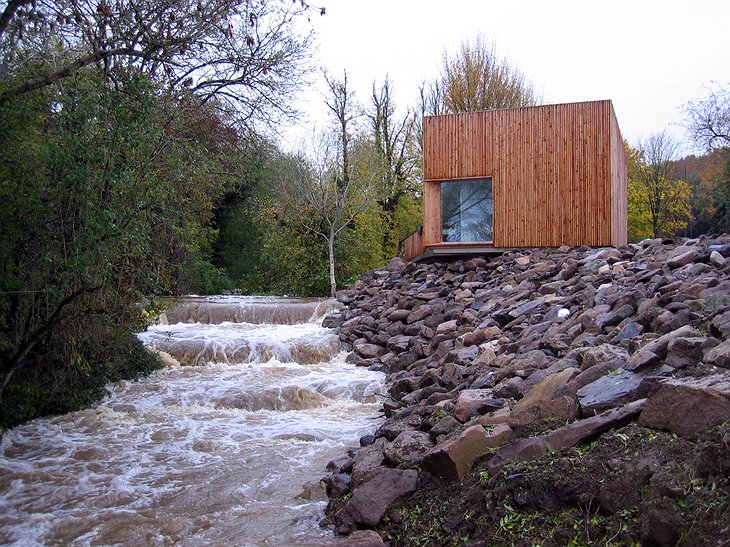 Glencomeragh Hermitages wooden hut next to the river
