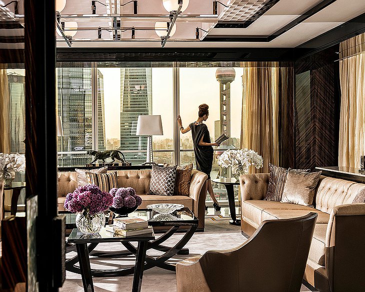 Regent Shanghai Pudong pearl suite with a classy woman looking at the city skyline