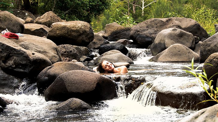 Girl bathing naked in the rapids
