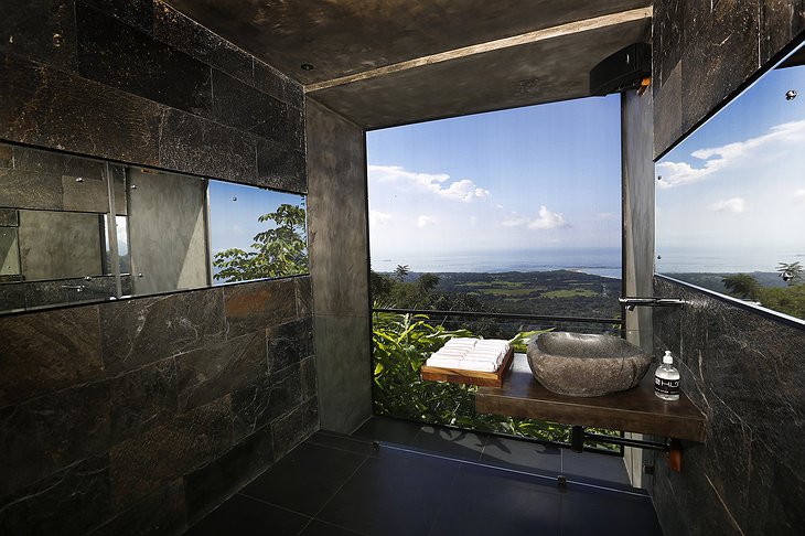 Bathroom with jungle and sea view