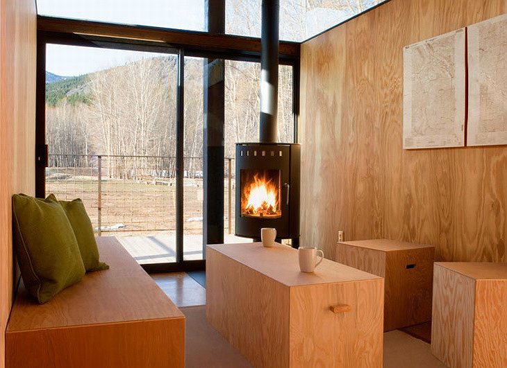 Rolling Huts wooden interior with fireplace