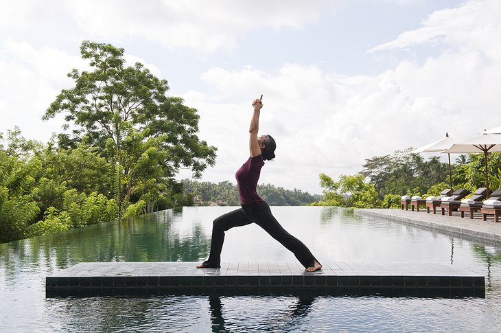 Yoga at the swimming pool of Alila Ubud