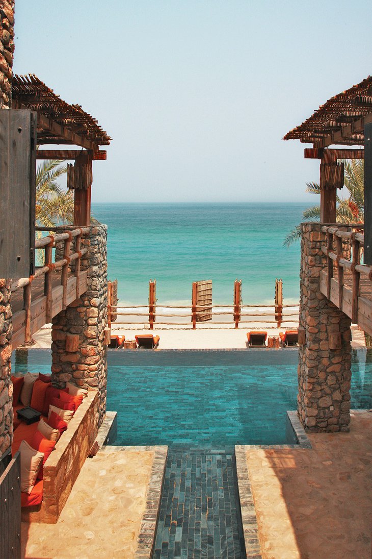 Six Senses Zighy Bay hotel view between the buildings to the swimming pool and the sea