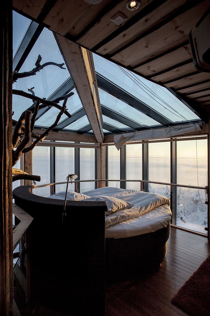 Rounded bed with snowy scenery outside