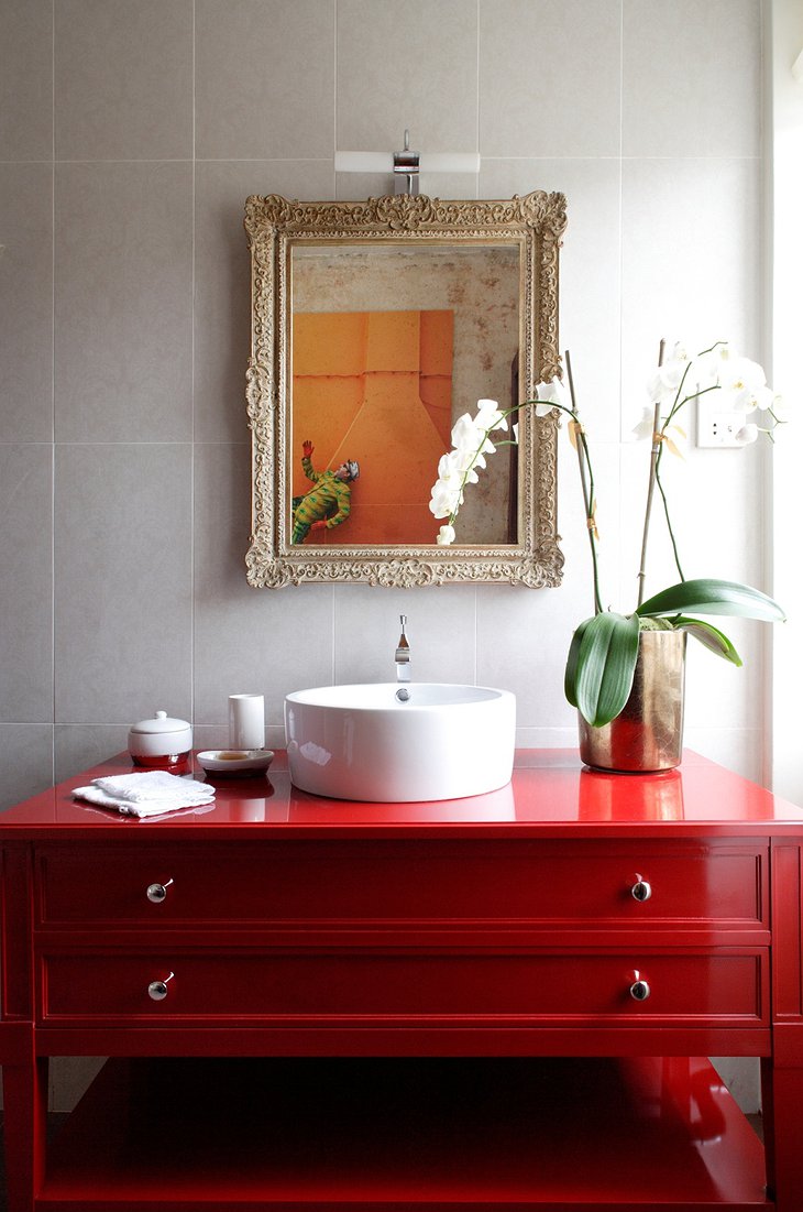 Rough Luxe Hotel red bathroom furniture