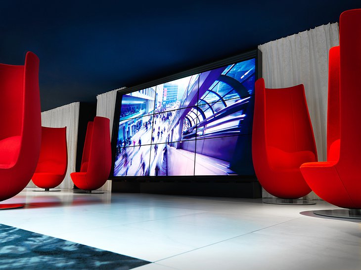 Andaz Amsterdam hotel lobby design chairs and large screen