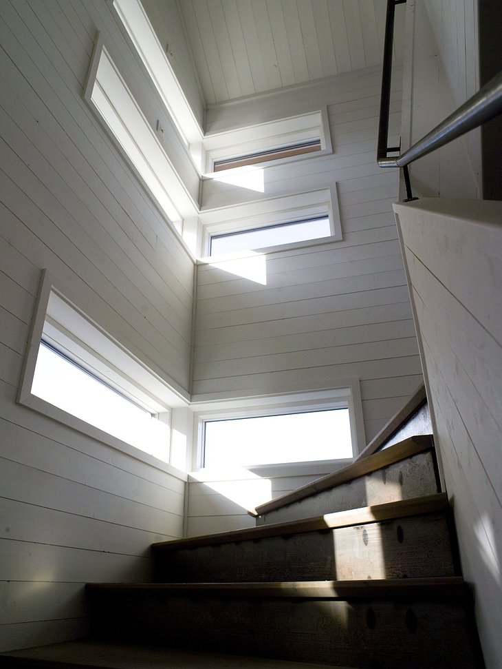 Stairs and light coming through the windows
