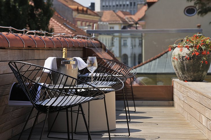 Vander Urbani Resort rooftop chairs and champagne