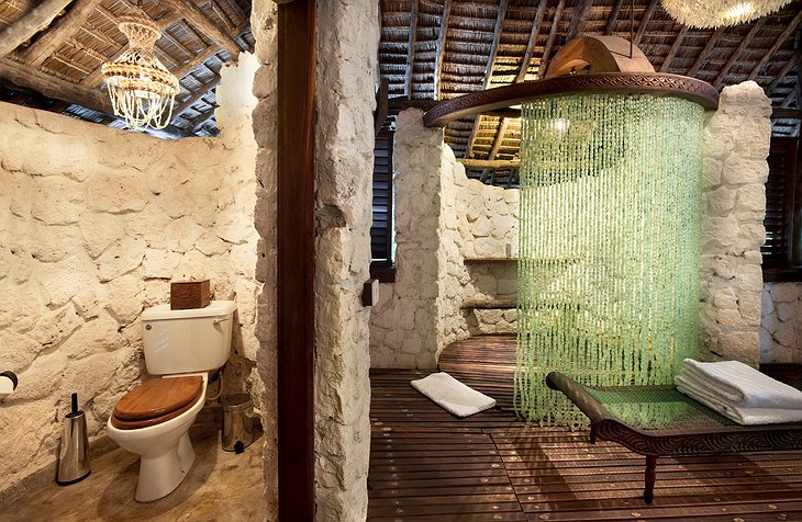 andBeyond Mnemba Island bathroom with toilet and shower