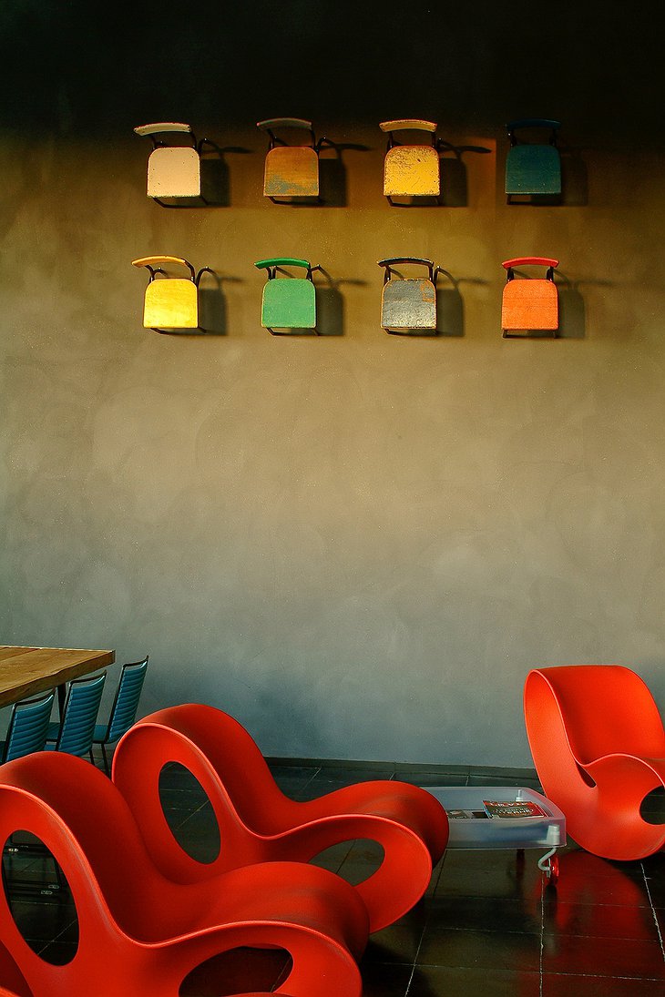 La Classe design chairs and colorful chairs on the wall