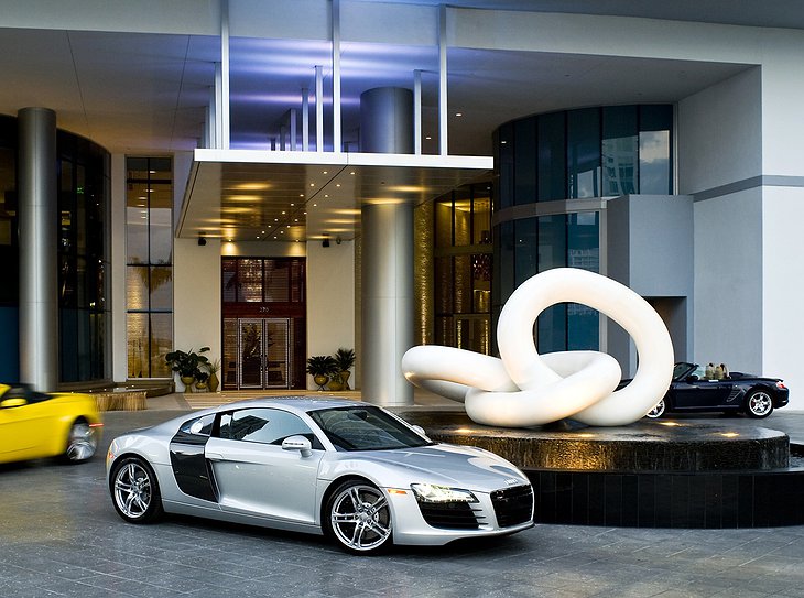 Epic hotel entrance with supercars parking in front