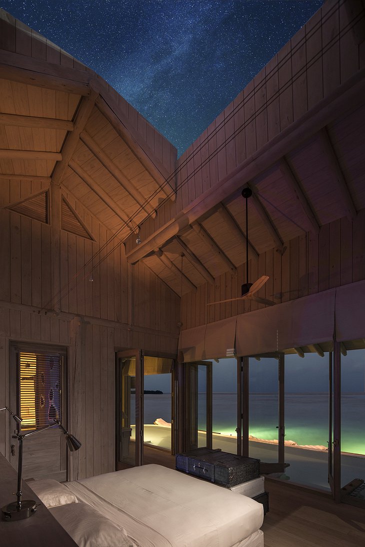 Soneva Jani Maldives villa bedroom with open roof to sky at night