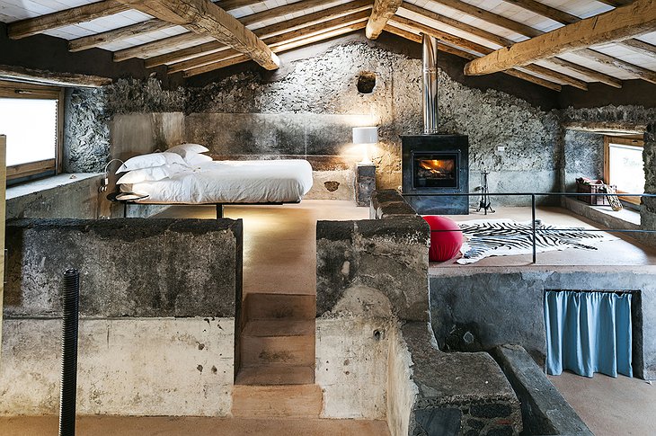 Monaci delle Terre Nere stone wall suite with fireplace