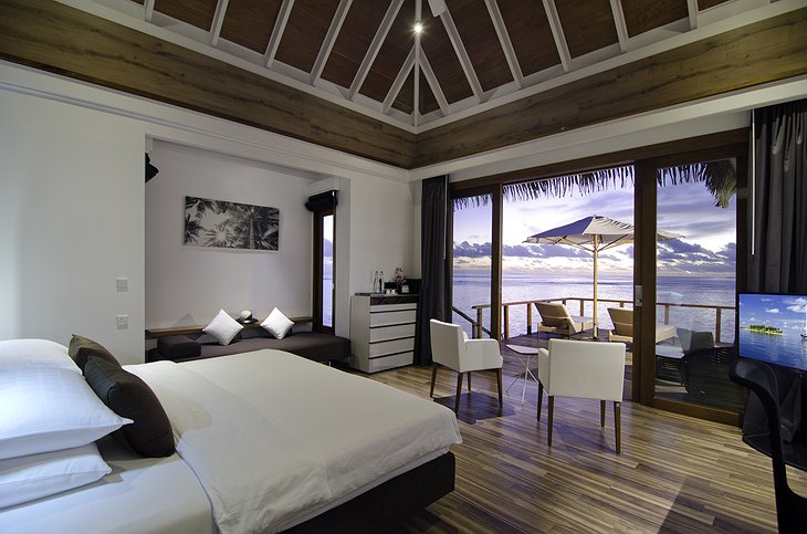 Kandolhu Island water villa bedroom