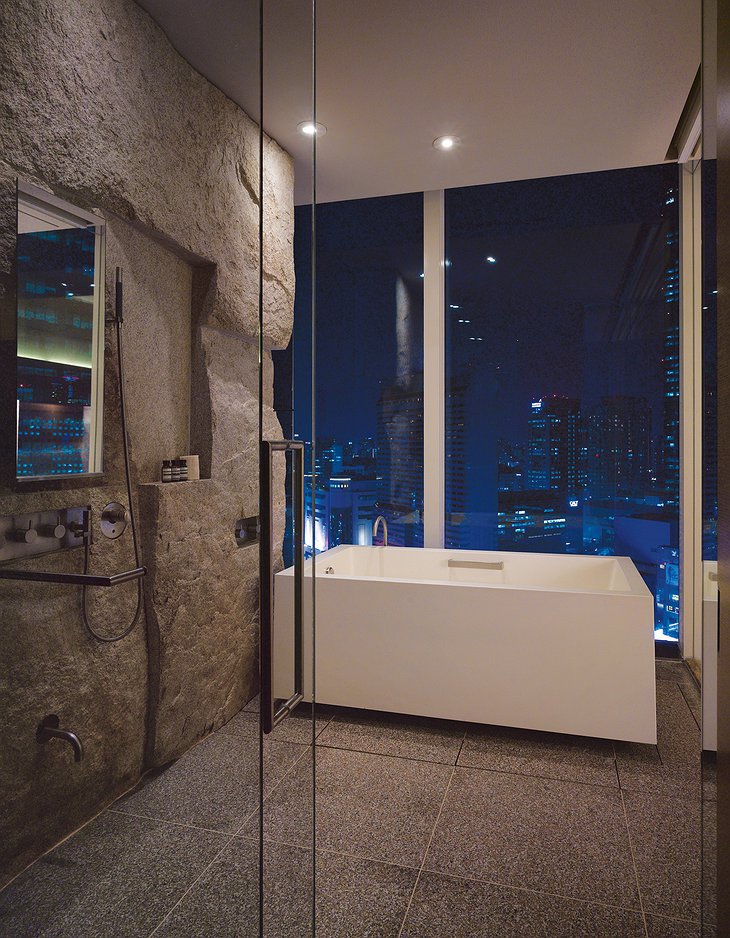 Park Hyatt Seoul deluxe bathroom at night with panorama on the city