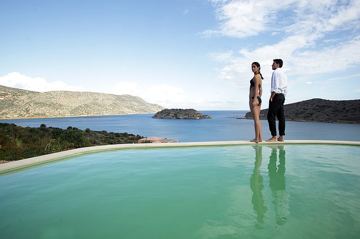 Domes of Elounda couple at the edge of the private pool