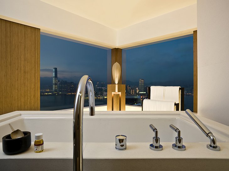 The Upper House hotel bathroom with views at night