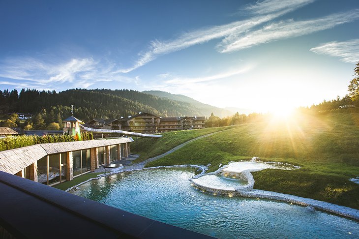 Green Spa Resort Stanglwirt Outdoor Pool with Slide and Mountain View