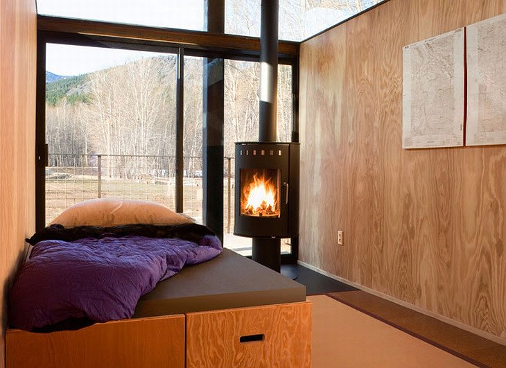 Rolling Huts bedroom with fireplace
