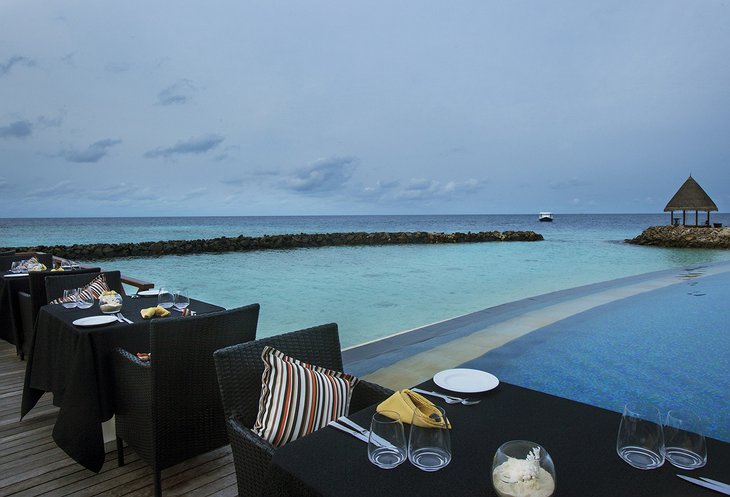 Vivanta By Taj - Coral Reef dining with pool and ocean views