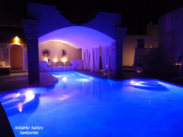 Infinity pool at night at Astarte Suites Hotel