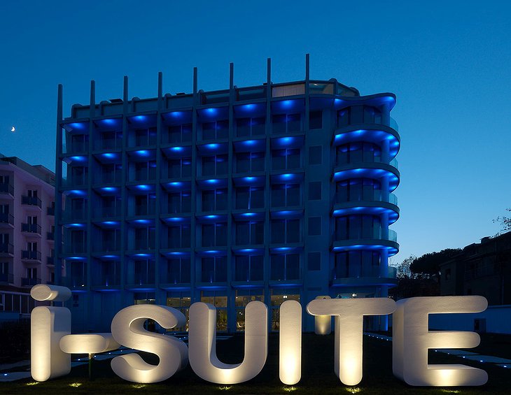 i-Suite Hotel Rimini building with neon sign
