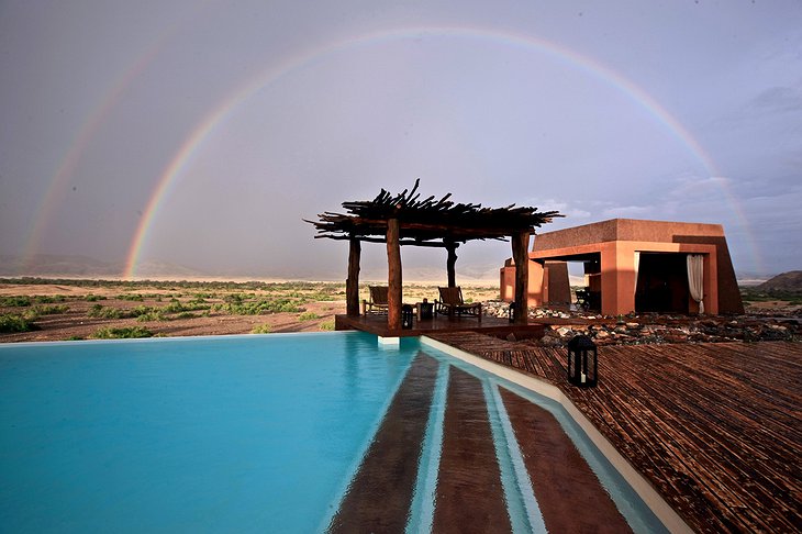 Okahirongo Elephant Lodge pool with rainbow
