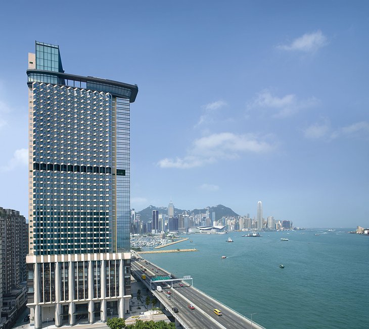Harbour Grand Hong Kong exterior of the tower with Hong Kong skyline