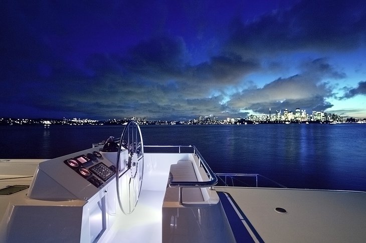 Necker Belle at night with city skyline