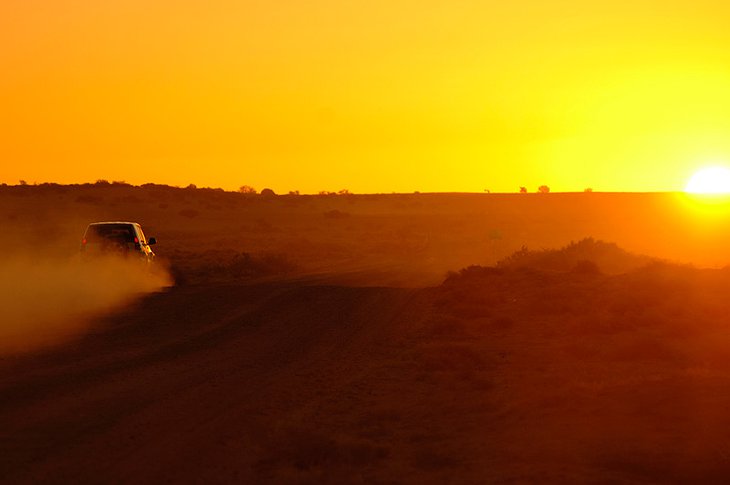 Toyota Land Cruiser in the desert at sunset