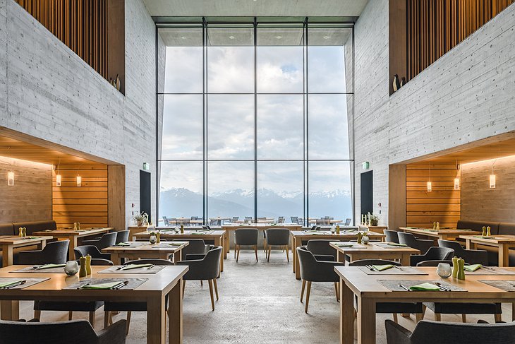 Hotel Chetzeron restaurant with giant floor to ceiling windows with view to the Alps