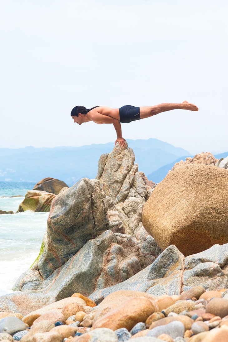 Extreme yoga on the beach