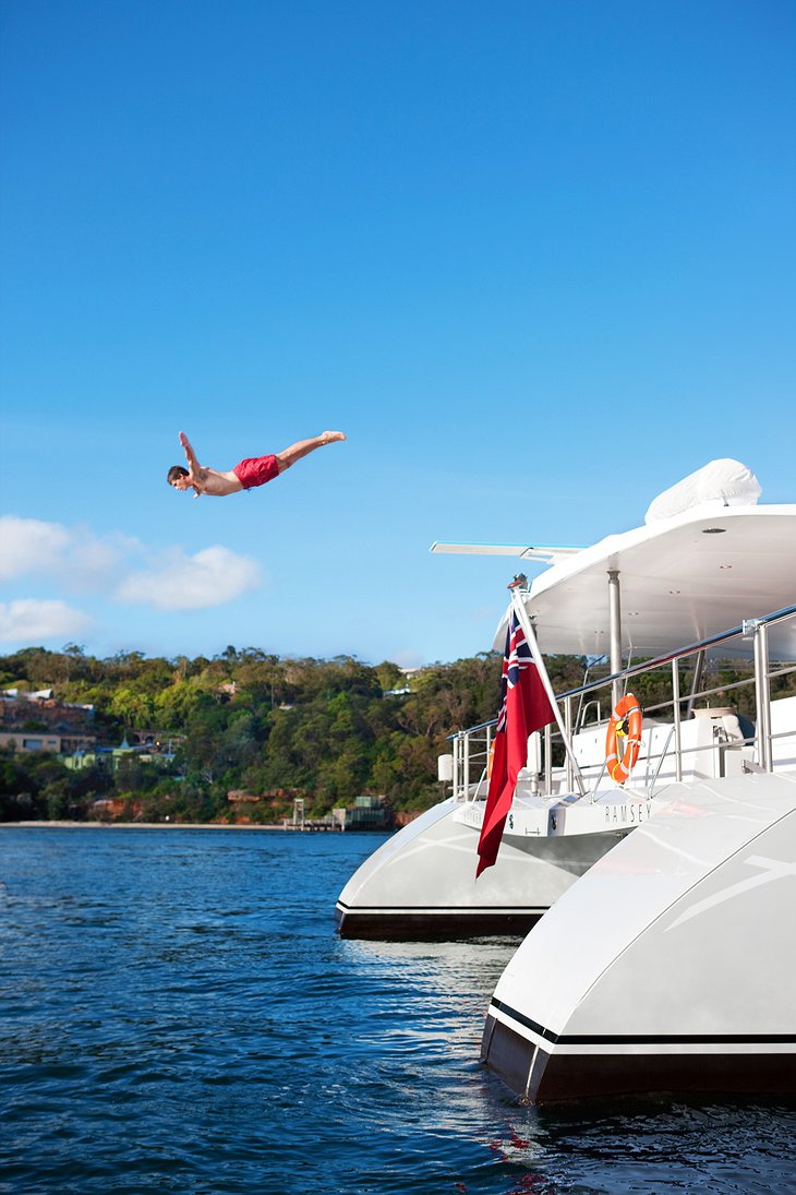 Jumping from the dock of Necker Belle yacht