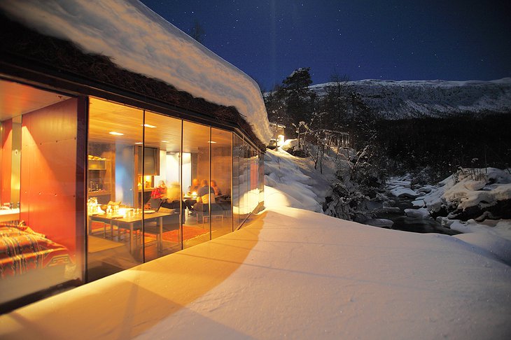 Juvet Landscape Hotel spa exterior in winter full of snow