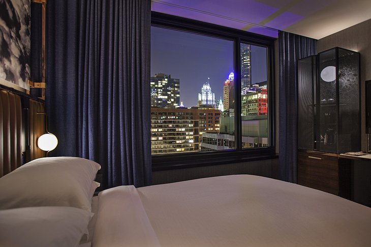 Hotel EMC2 Bedroom with Night Chicago View